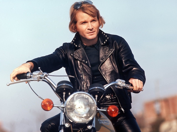 Fritz Wepper on a motorcycle in a scene of the movie "Krambambuli".