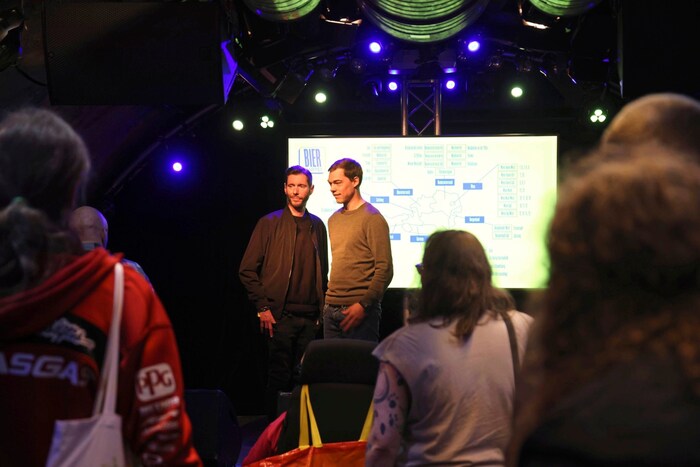 Jegle and Schuster (right) on stage in front of around 40 interested people