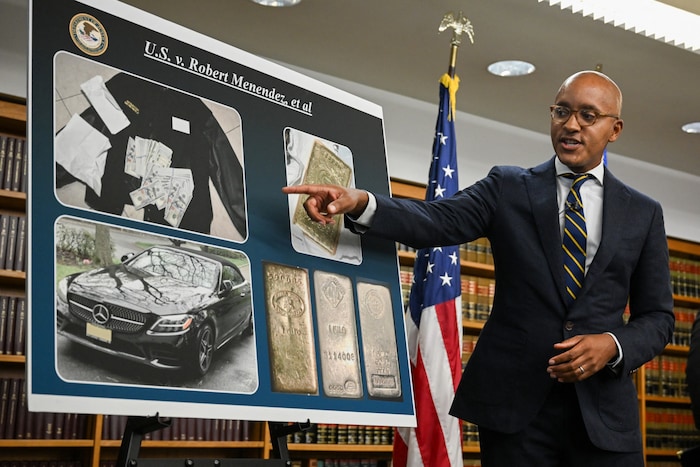 A public prosecutor points to the evidence found.