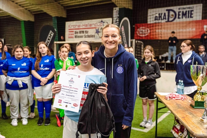 Austria captain Verena Volkmer with Mia Jungwirth, the best player of the final.