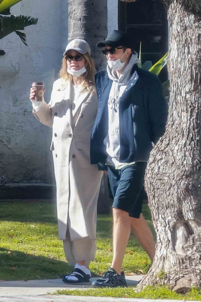 Robert Pattinson and Suki Waterhouse on a walk before the birth of their child.