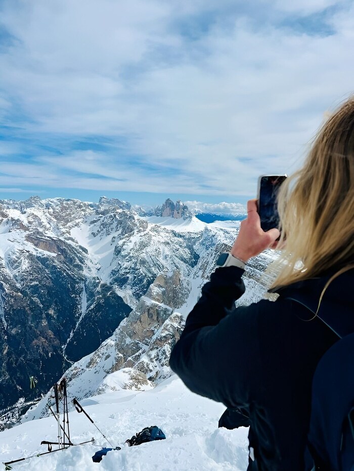 She had to whip out her smartphone for a souvenir photo of the famous Three Peaks.