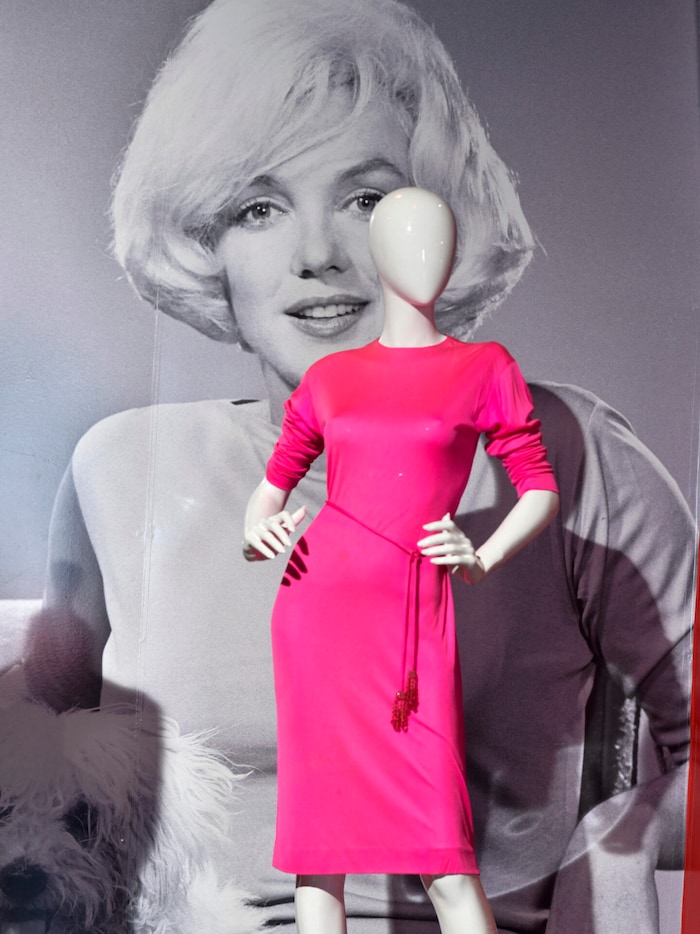 This pink designer dress worn by Marilyn Monroe was also auctioned off.