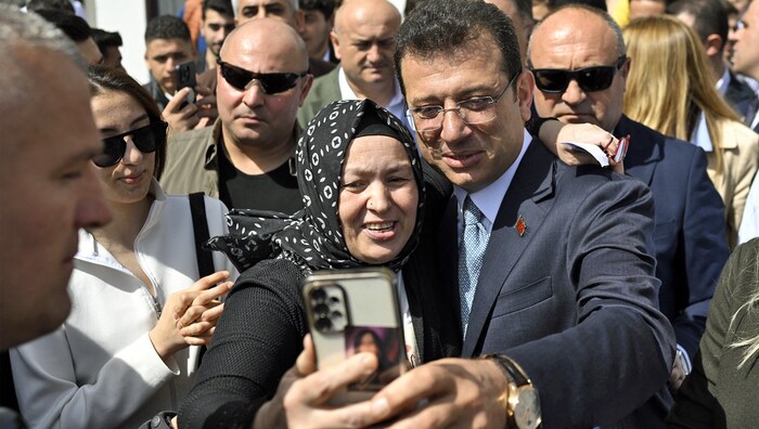Istanbul election winner Ekrem Imamoglu takes a selfie in the crowd.
