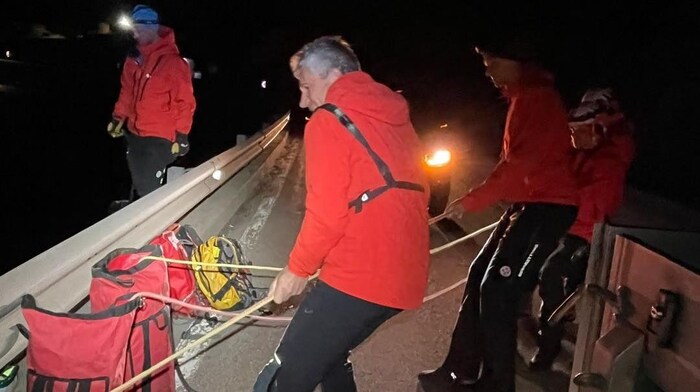 The mountain rescuers joined forces to pull the 40-year-old up.