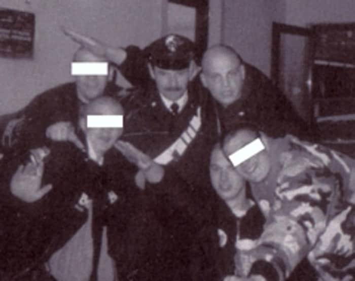 Philipp Burger (back) raises his hand in the Hitler salute. 