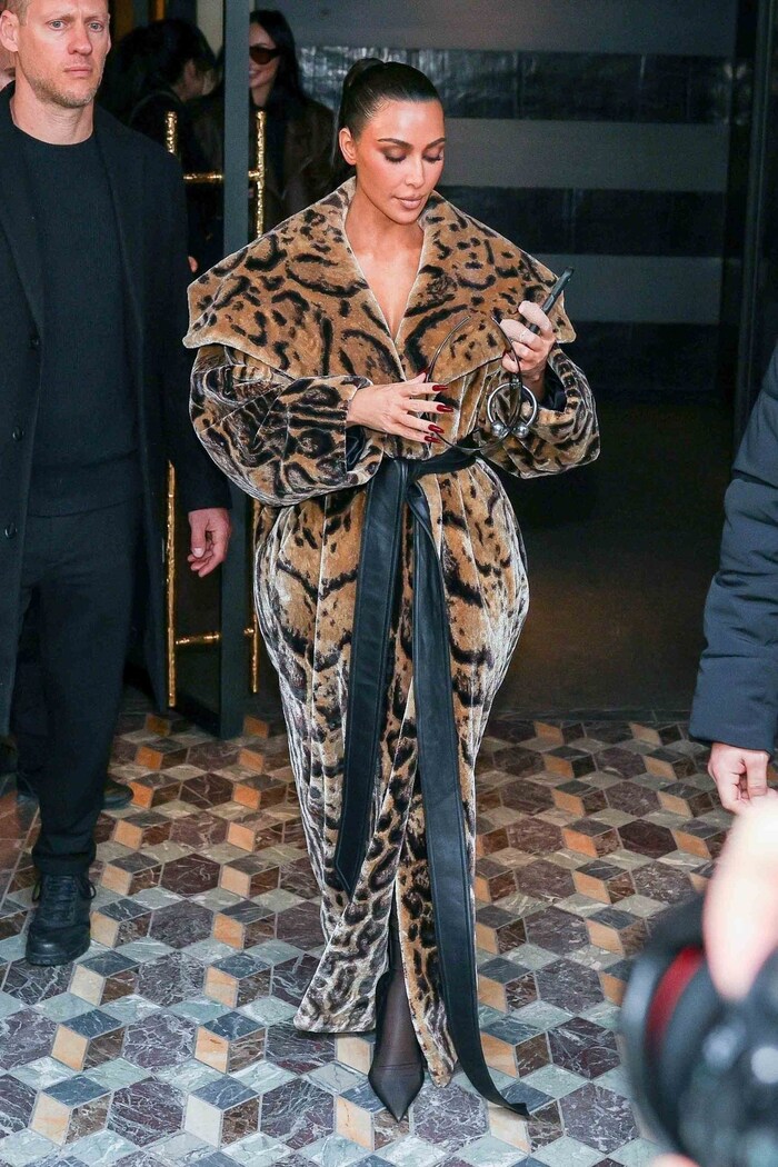 Kim Kardashian seemed to have forgotten her top under her stunning leopard print coat.