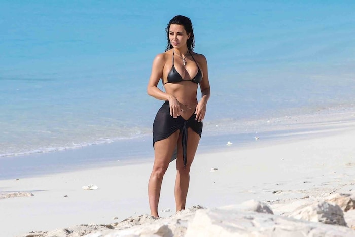 Kim showed off her hot curves in an XXS bikini.
