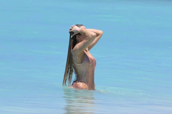 The reality stars lolled around in the water for hot photos.