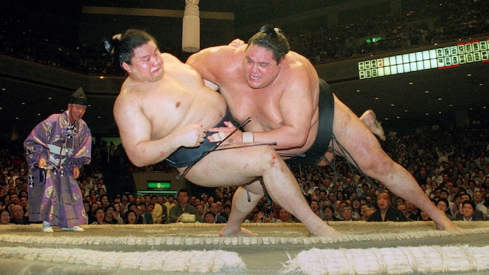 Akebono (right) during one of his fights. 