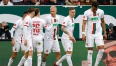 Augsburg bejubelt drei Punkte gegen Union Berlin. (Bild: APA/AFP/MICHAELA STACHE)