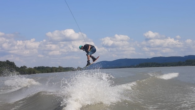 Wakeboarding is a mixture of water skiing and surfing.