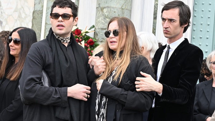 Eva Cavalli with two of Cavalli's children at Roberto Cavalli's funeral in Florence