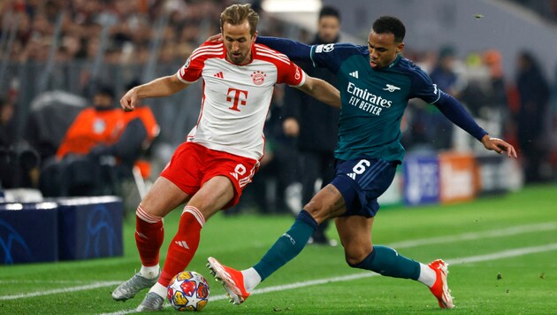 Harry Kane (l.) in a duel with Arsenal's Gabriel Magalhaes (Bild: APA/AFP/Michaela STACHE)