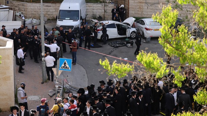 Ultra-Orthodox Jews gathered at the scene.