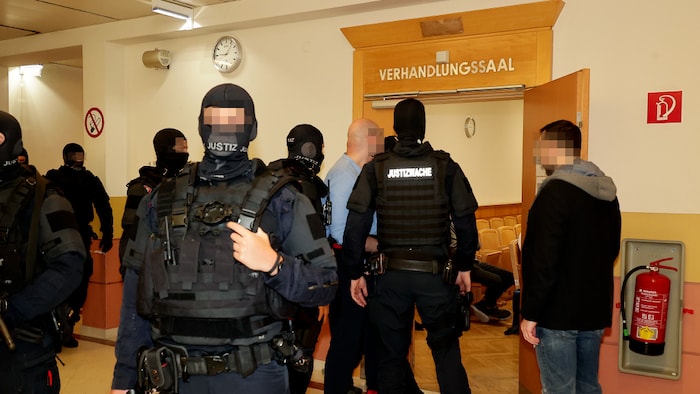 Lorenz K. is led into the courtroom heavily guarded and under the highest security precautions.