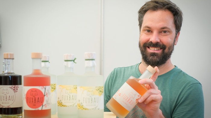 Andreas Bauer entices visitors with his Fuxbau spirits.