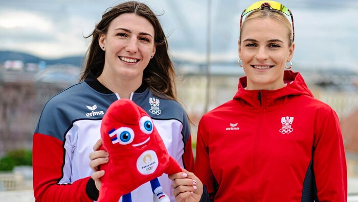 Judoka Michaela Polleres and javelin thrower Vicky Hudson with mascot.