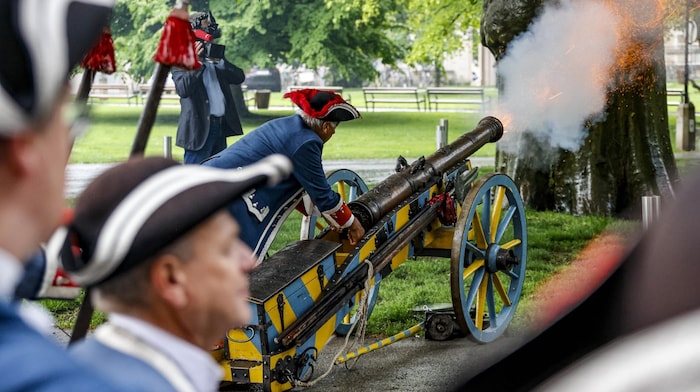 The citizens' guard attended the swearing-in ceremony and greeted the new mayor with a gun ...