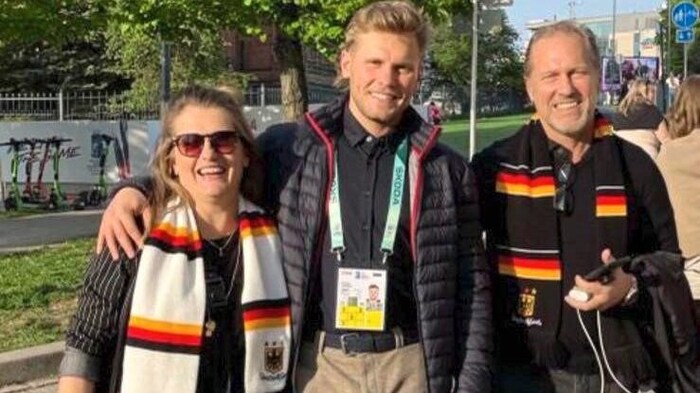 Tray Tuomi (right) with his wife Anke and son Parker.