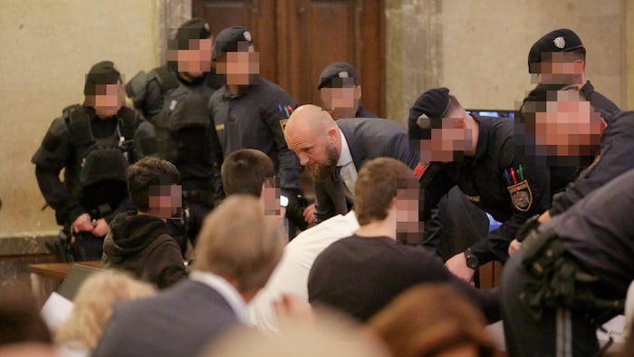 Lawyer Florian Kreiner with his client in the courtroom