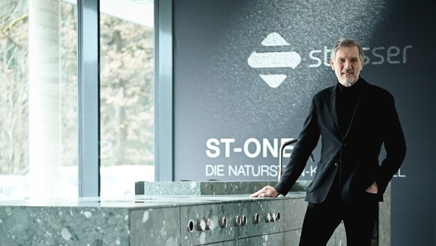 Johannes Artmayr, here next to the ST-ONE kitchen island made of natural stone.