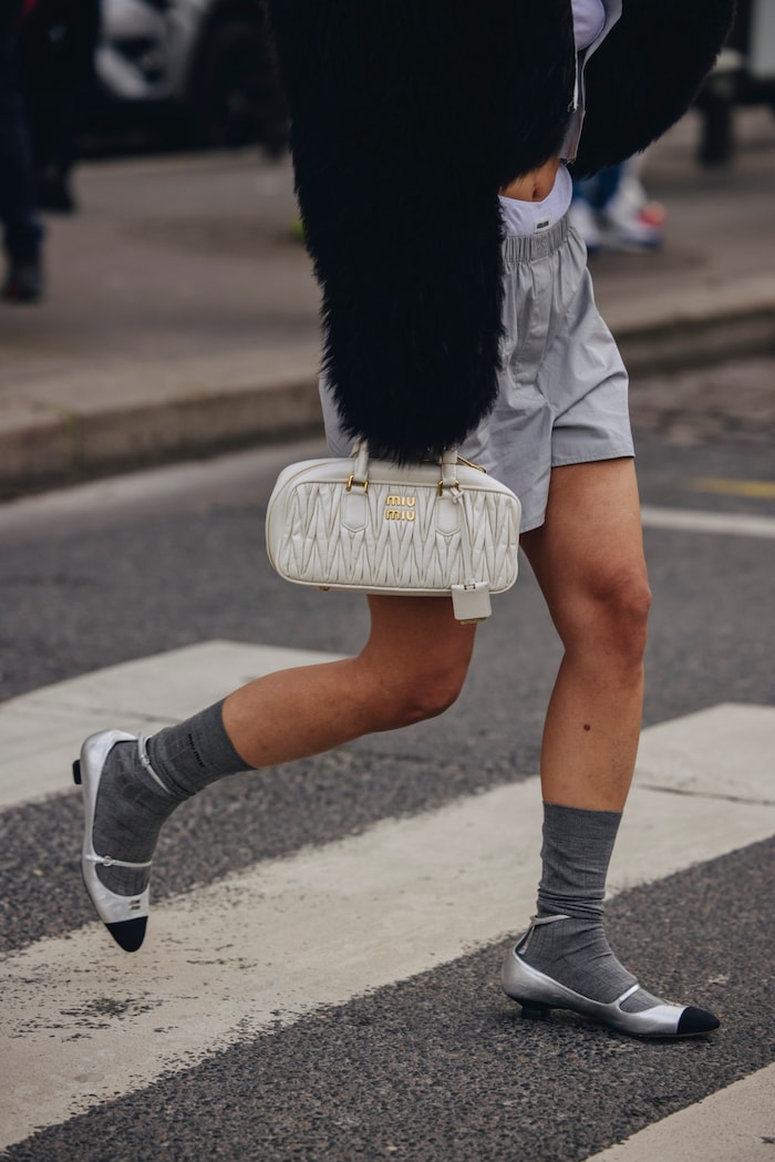 The dainty kitten heels give the boxer shorts look a feminine touch.