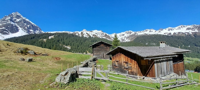 The trail leads past one of the typical Maisäß huts.