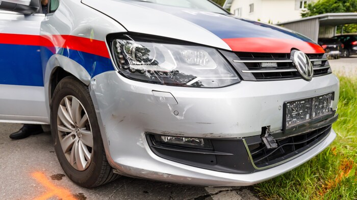 Three police vehicles were damaged.