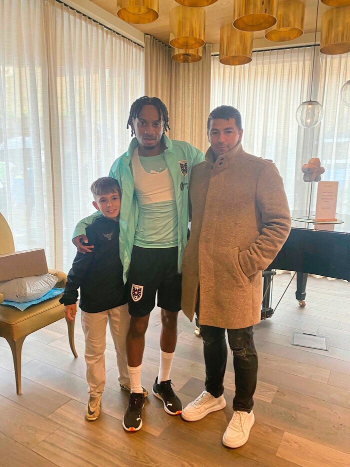 Huemerlehner (right) with his biological son Pepe (left) and Ballo.