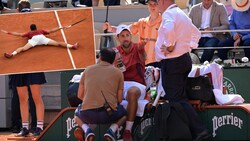 Novak Djokovic zaubert und gewinnt, doch sein Antreten im Viertelfinale wackelt. (Bild: AFP/APA/Bertrand GUAY, AP)