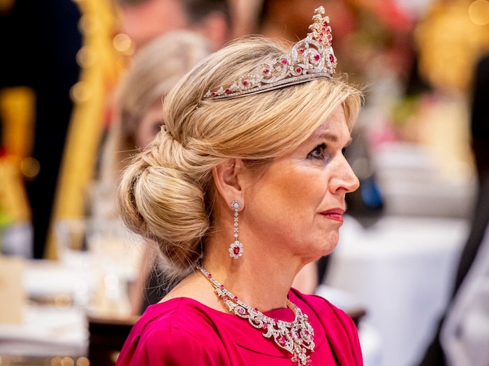 Maxima's jewelry sparkled.