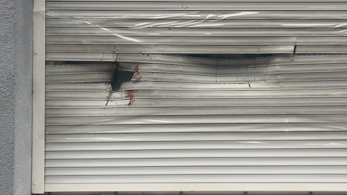 The perpetrator struck this window with a bloody axe.