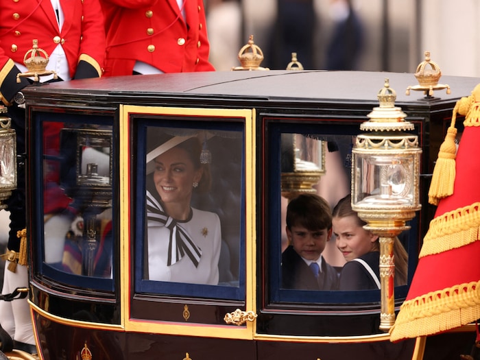 Princess Kate gives the cheering crowd a smile.