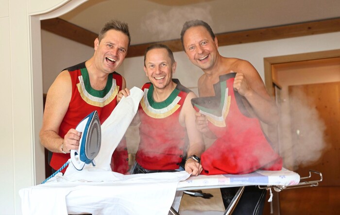 The Juzis ironing their costumes before their performance at the Summer Open Air. 