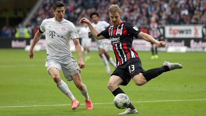 Martin Hinteregger (right) scored ten times against Robert Lewandowski.