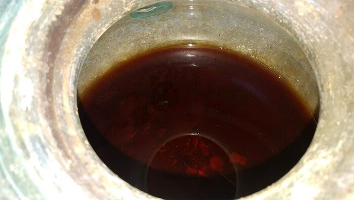 The wine was poured over the bone remains in the urn as grave goods.