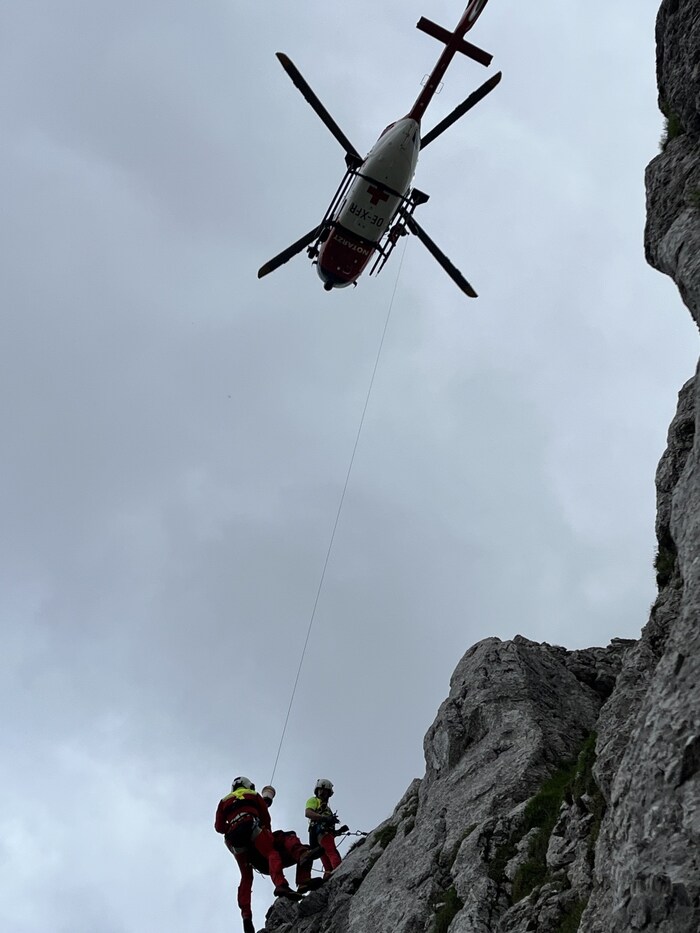 The helicopter is briefly "tied" to the rock face.