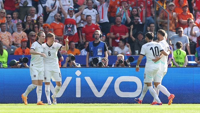 Austria celebrate their 1:0 lead.