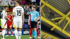 Ein Maskenmann auf dem Stadiondach sorgt für Aufregung in Dortmund. (Bild: APA/AFP/KENZO TRIBOUILLARD, X.com/MailSport)