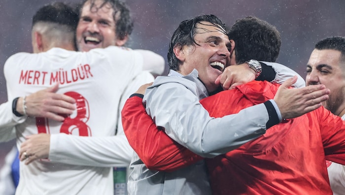 Vincenzo Montella (center; grey jacket) celebrates with his team.