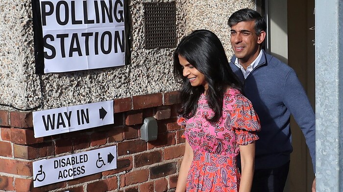 Britain's Conservative Prime Minister Rishi Sunak leaves the polling station with his wife ...