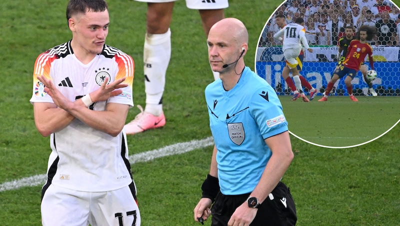 Marc Cucurella gets the ball to his hand, but Anthony Taylor did not award a penalty. (Bild: AFP/Kirill KUDRYAVTSEV)