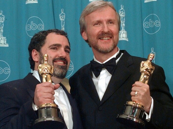 James Cameron, right, and Jon Landau with the Oscars for Best Picture for the film "Titanic" at ...