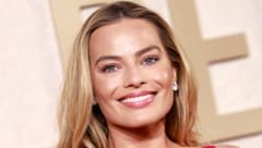 Margot Robbie ist Medienberichten zufolge zum ersten Mal schwanger. (Bild: APA/AFP/Michael TRAN)