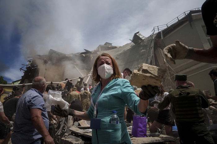 Rescue workers do their best after Russian missiles hit a children's hospital in Kiev.