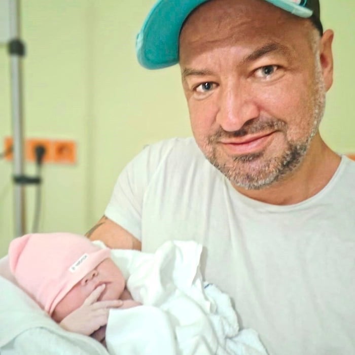 Chris Raaber with daughter Lucia in his arms