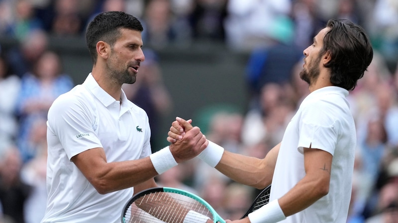 Novak Djokovic and Lorenzo Musetti (Bild: AP)