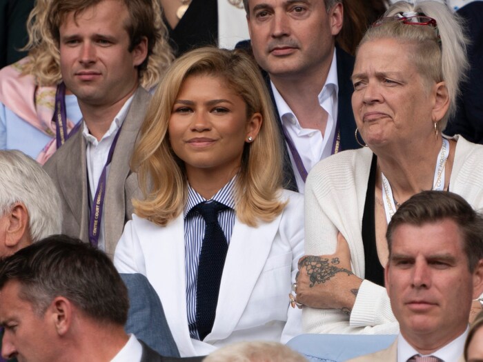 Zendaya with a white jacket and tie at the Wimbldeon tennis tournament