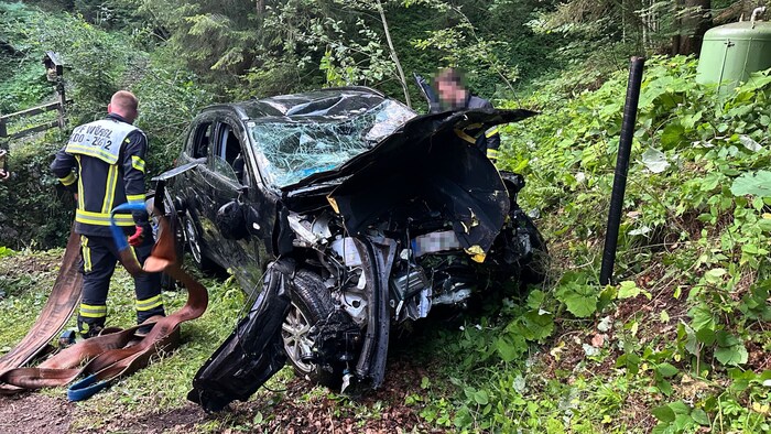 The severely damaged car